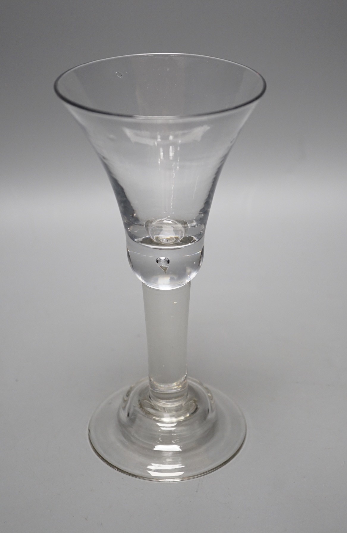 A George II glass goblet, domed foot, 19cm tall